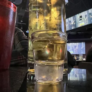 a glass of beer on a table