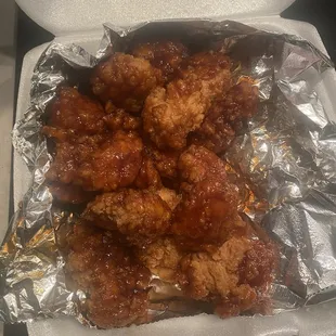 a chicken dish in a styrofoam container