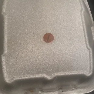 a brown spot on the lid of a styrofoam container