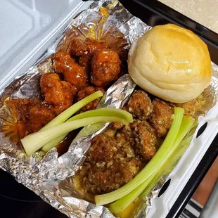 Boneless wings and yeast roll. Fire, mango habanero and garlic sauce.