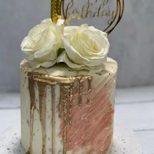 a birthday cake with roses on top