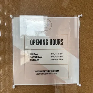 a sign for opening hours