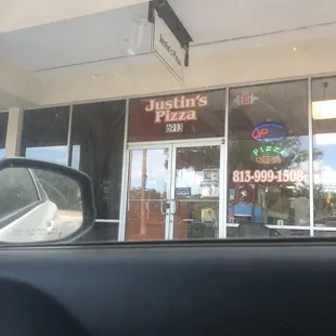 Justin&apos;s pizza outside store