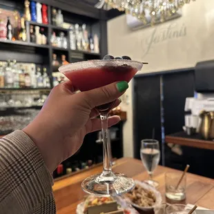 a person holding a glass of wine