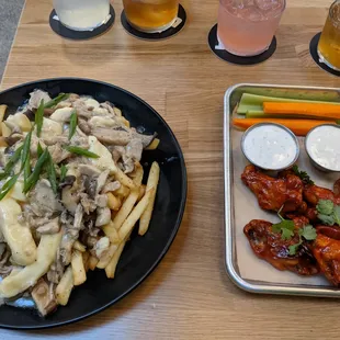 Poutine and gochujang wings, and the drink flight.