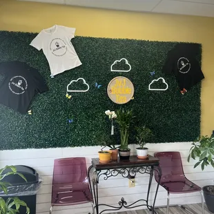 t - shirts hanging on a wall