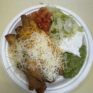 Loaded plate of flautas