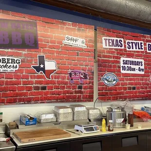 a brick wall with stickers on it