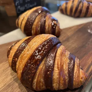 two croissants on a cutting board