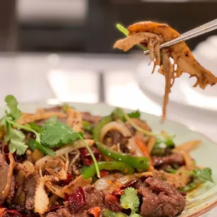a plate of food with meat and vegetables