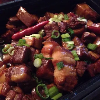 Chef Traditional Cooked Pork Belly in Pot