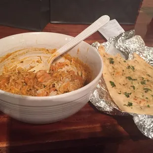 Get the butter chicken, with rice and garlic naan. Good grief! Even if you have a sensitive palette, this dish is amazing.