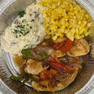 Smothered Turkey Chop dinner with Red Bliss Garlic Mash Potatoes,  &amp; Butter Corn