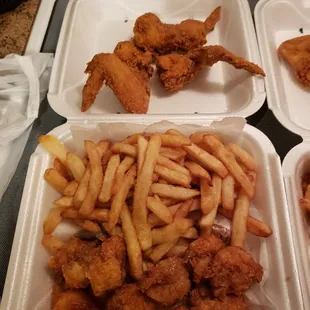 chicken and fries in a styrofoam container