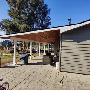 Your can see the white wrap around the posts and beam on my new back patio. Awesome job!