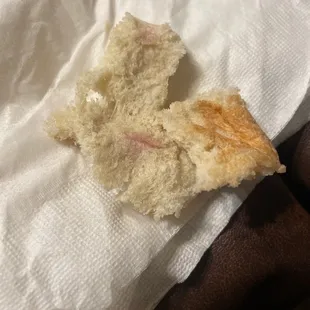 Weird red marks in most of the bread, think it might be red mold.  It was also found in other pieces of bread.