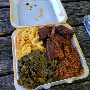 Jerk chicken, Mac and cheese, yam, collard green, brown stew chicken.