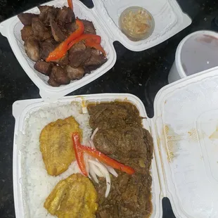 Legume and Fried Pork (Griot) with white rice and beans.