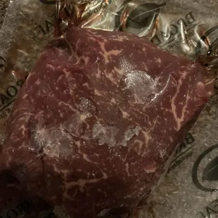 a piece of meat wrapped in foil