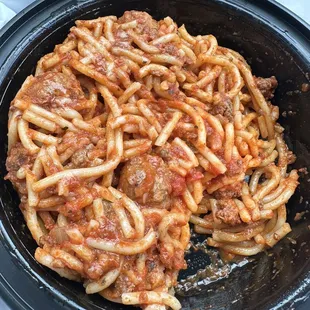 a plate of spaghetti and meat