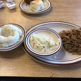 BBQ pork platter with cole slaw and mashed potatoes