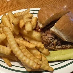 Lunch special &quot;regular&quot; sandwich with pulled pork and ham and fries.