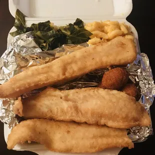 Fried fish, greens, Mac and cheese, and hush puppies.