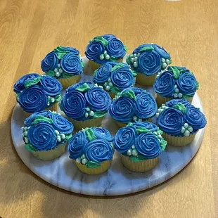 Hand decorated vanilla cupcakes, roses and babies breath