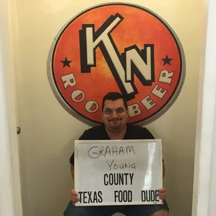 a man holding a sign
