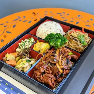 a bento box of food
