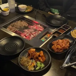 29.99 option- Table with a variety of meats and appetizers.