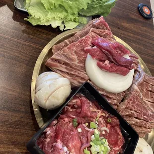 a plate of meat and vegetables