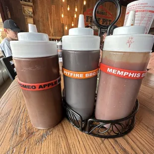 Sauces in the tables. Huge bottles of delicious, house made sauces!! That Romeo Apple was the table favorite!