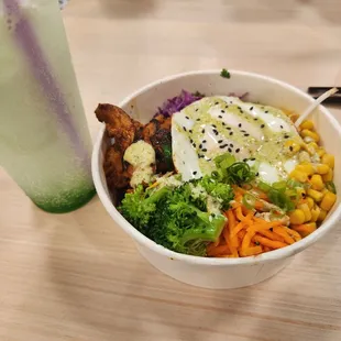 a bowl of food and a drink