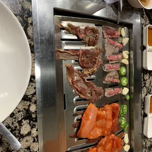 Brisket, beef bulgogi, spicy chicken thighs, garlic and jalapeños, oh that smell