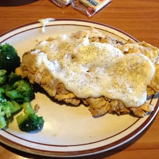 Texas sized Chicken Fried Steak with steamed broccoli