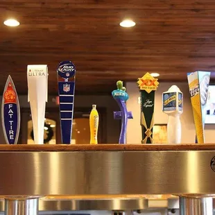 a row of beer taps