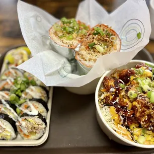 a plate of sushi and a bowl of rice