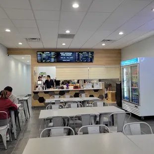Front of the counter and ordering kiosk on the far right wall.