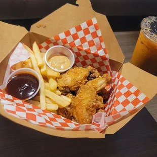 a basket of fried chicken and french fries