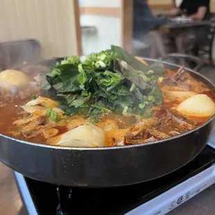 Spicy pork rib stew with potato in hot pot