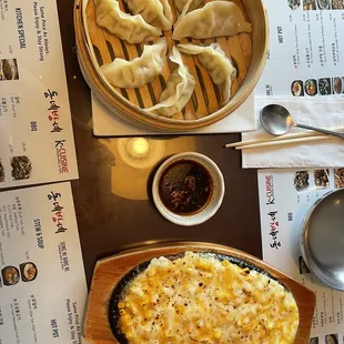 dumplings in a basket and a plate of dumplings