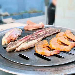 Outside dining - grilling some shrimp, kalbi, and bbq marinated chicken.