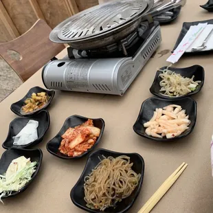 Banchan spread and outdoor set up.