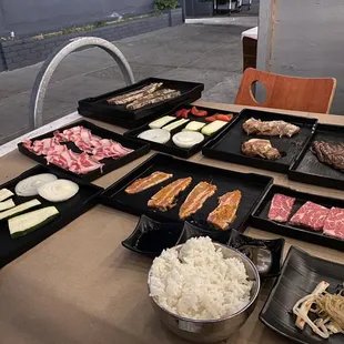 Spread of meat, vegetables, and rice