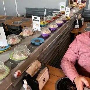  a woman sitting at a table with a plate of food