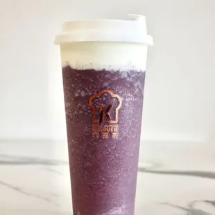 a cup of blueberry smoothie