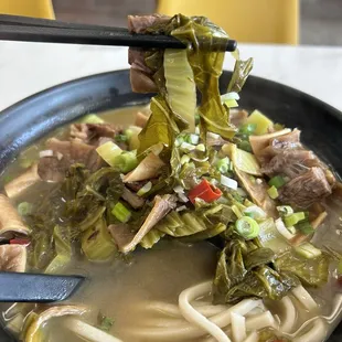 First bite of Sauerkraut Braised Beef Sirloin Noodles with Soup. Wish you could smell it.