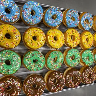 a variety of donuts on a rack