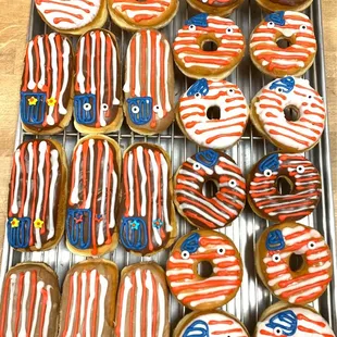 a tray of decorated donuts